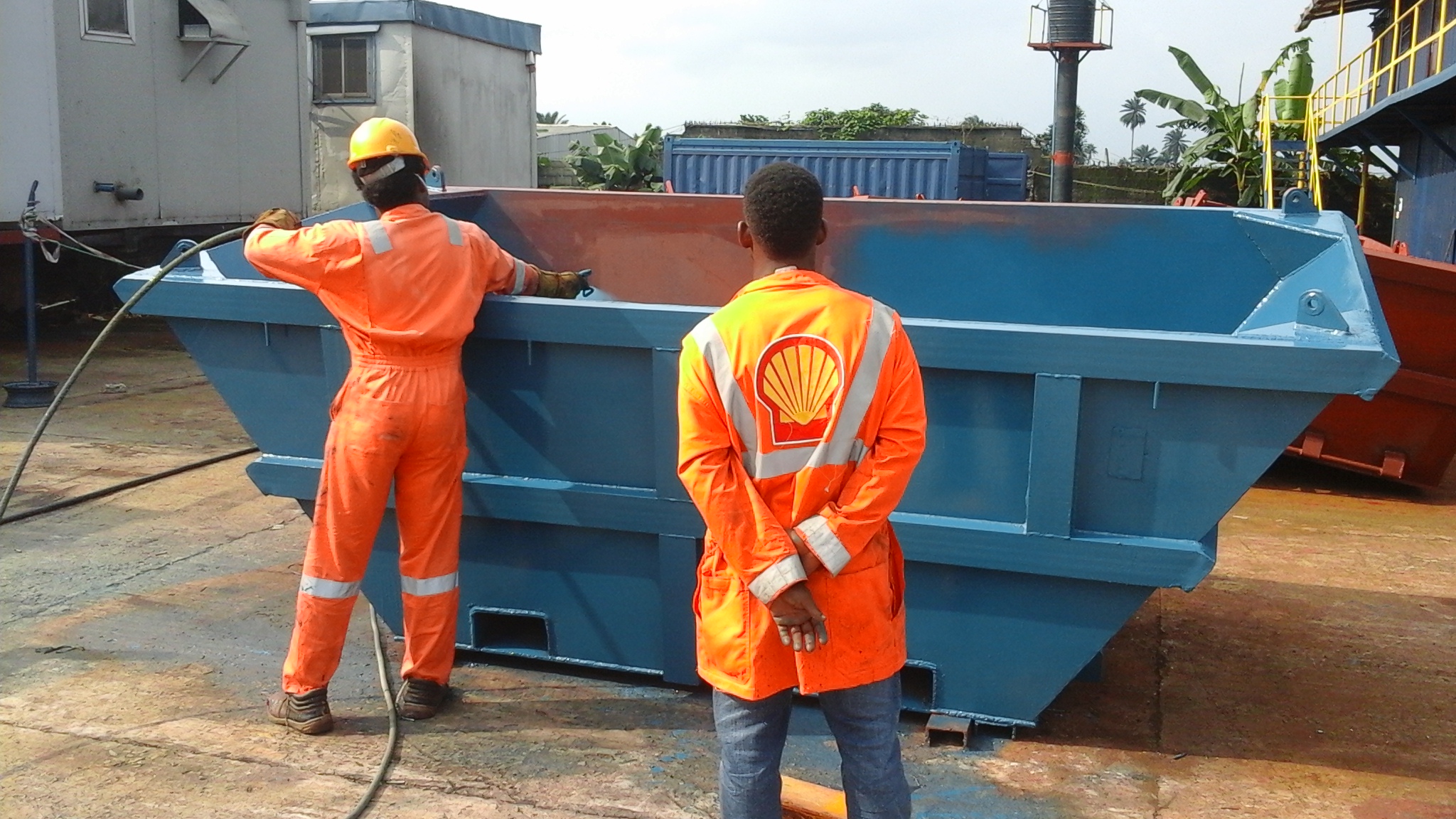 welder-spray-painting-waste-skips